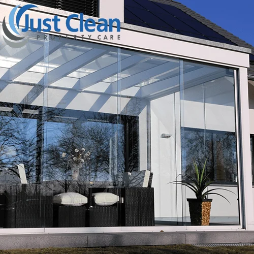Traditional glazed conservatory adjoining a house