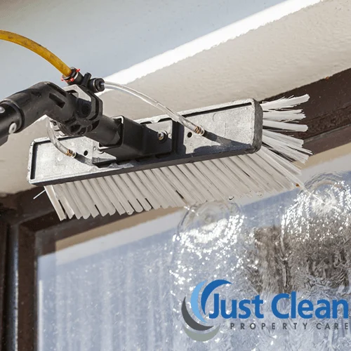 Roof cleaning wand working along curved tiles