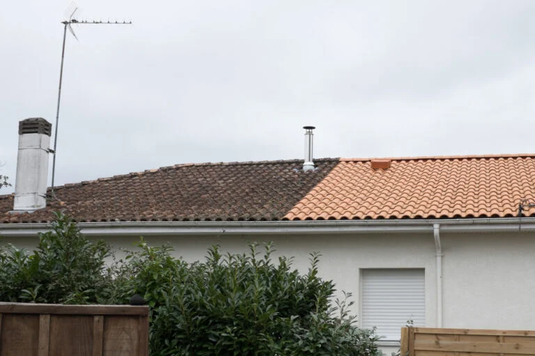 Roof tiles beside a skylight