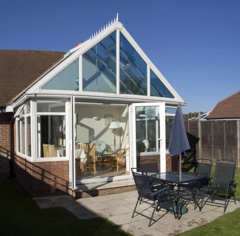 Traditional glazed conservatory adjoining a house