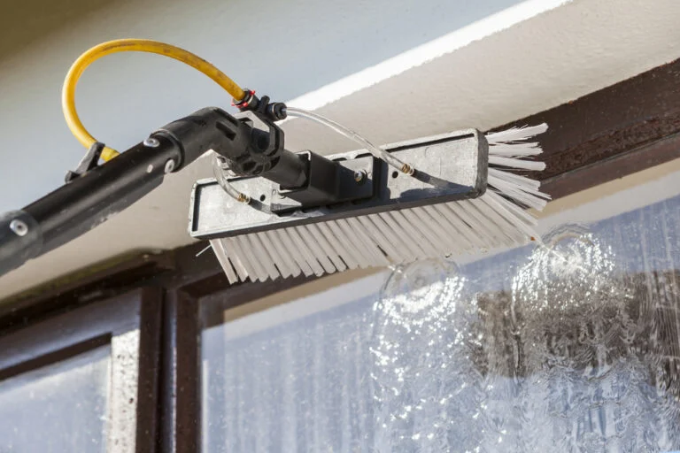 Roof cleaning wand working along curved tiles