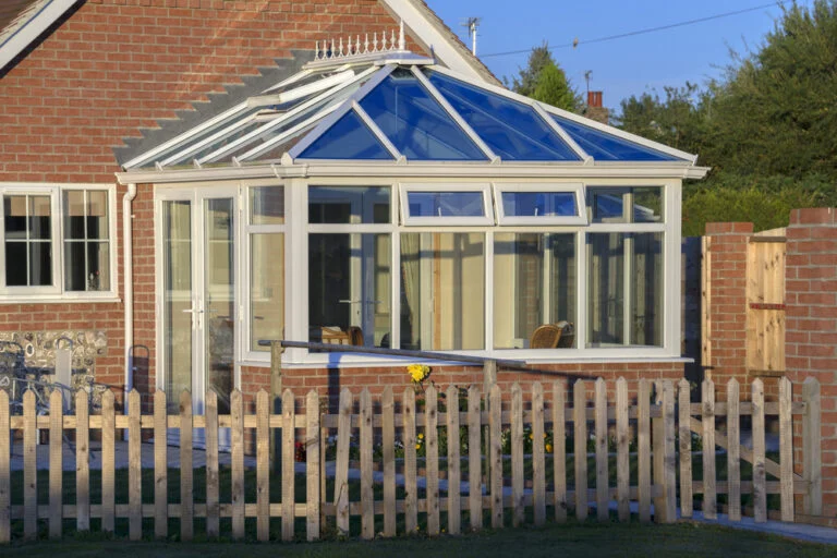 Traditional glazed conservatory adjoining a house