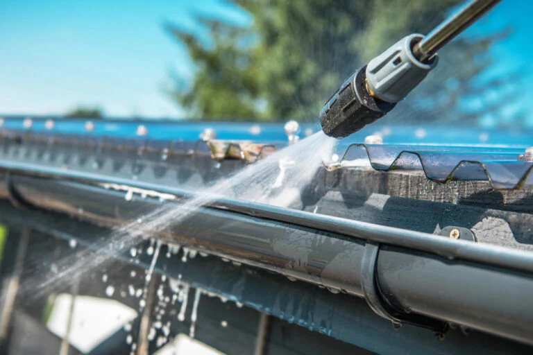 Worker cleaning a conservatory roof