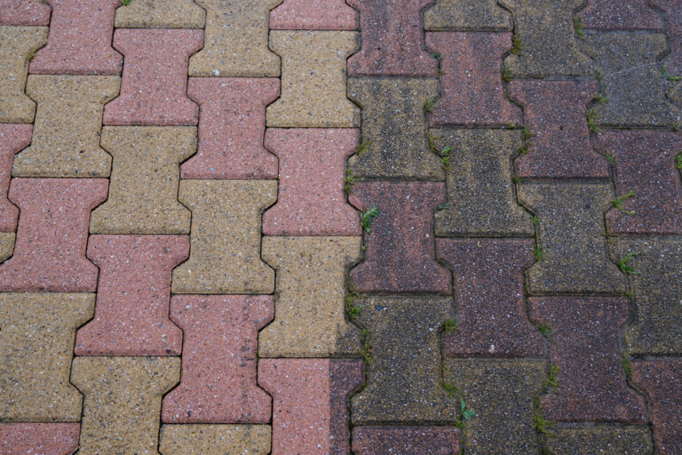 Block paving showing stained and cleaned sections