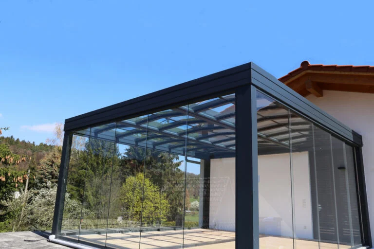 Modern glass extension with dark metal framing