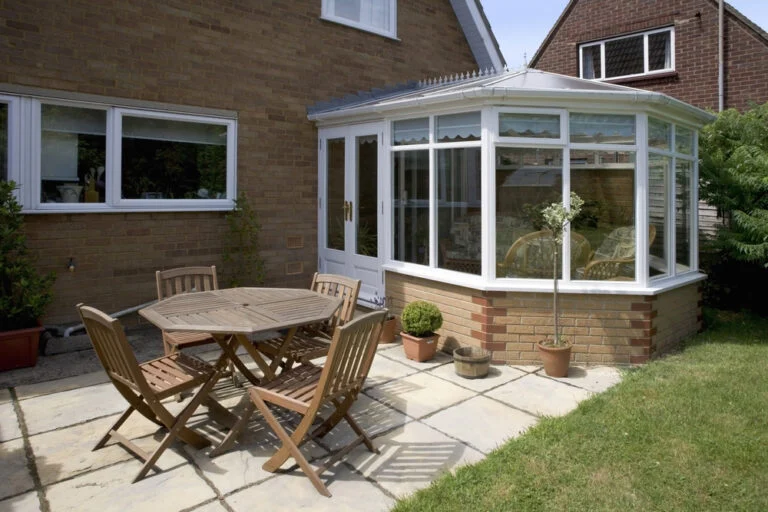 Patio beside a glass conservatory
