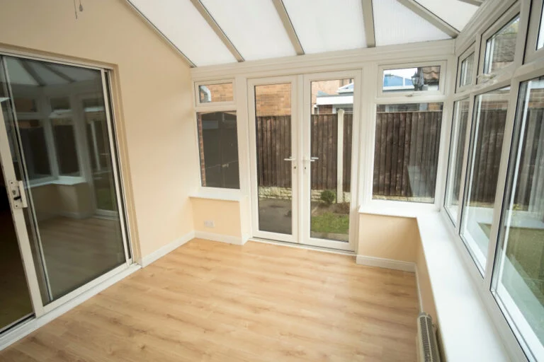 Traditional glazed conservatory adjoining a house
