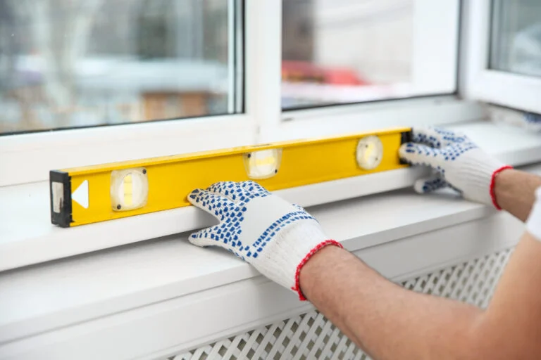 Fitting a window frame using a spirit level