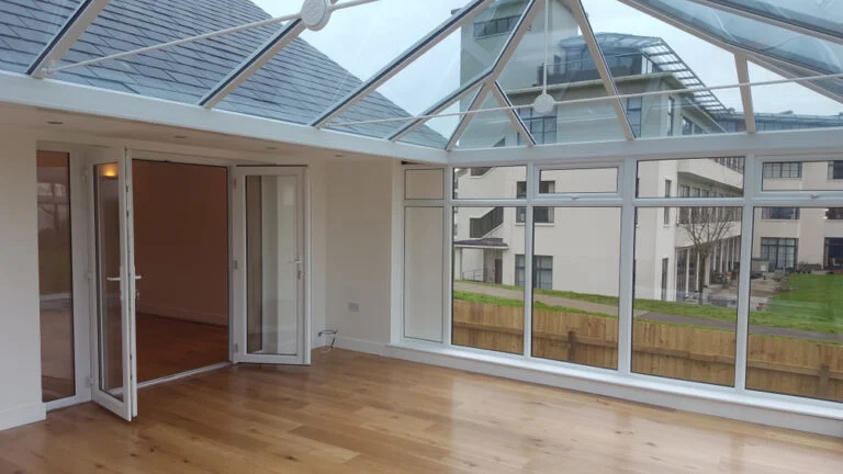 Traditional glazed conservatory adjoining a house