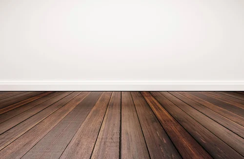 Wood flooring beside a plain wall