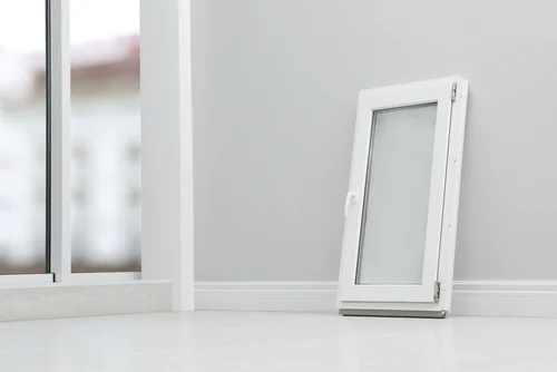 UPVC window sample beside a white door