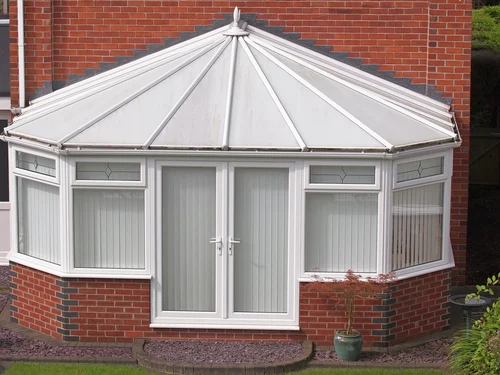 White-framed conservatory with an opaque roof