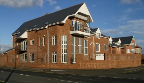 Brick property with white UPVC windows