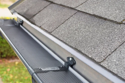 Gutter along the edge of a sloping roof