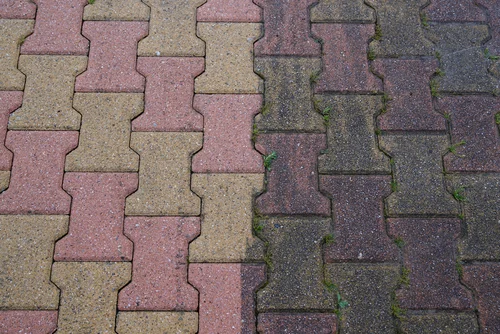 Block paving showing stained and cleaned sections