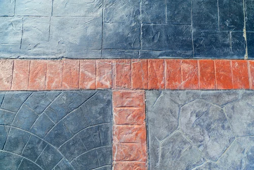 Weathered block paving with stained and clean sections