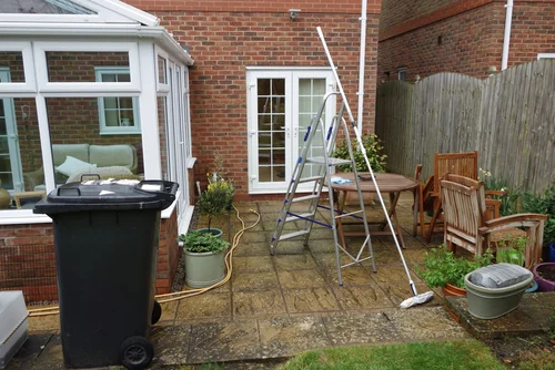 Patio beside a glass conservatory