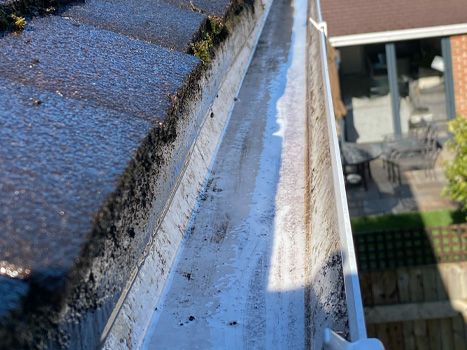 Gutters after being cleaned and moss removed