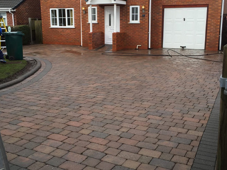 Clean driveway after being pressure washed