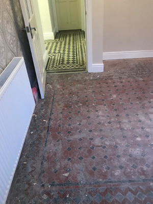 Dirty tile floor before being cleaned