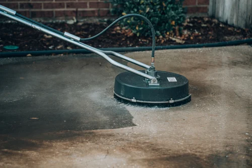 Surface cleaning machine washing paving