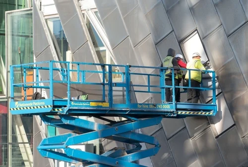 Commercial cladding being cleaned from an elevated platform