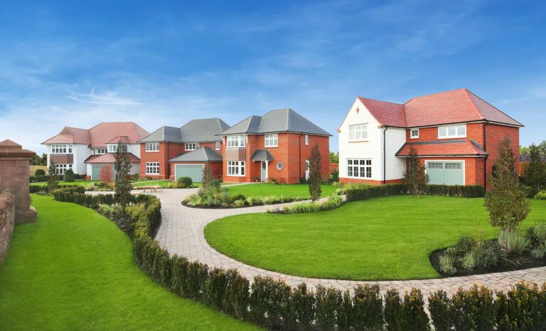 Recently built homes beside landscaped green space