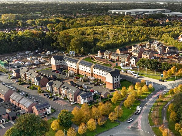Aerial view of homes beside a road junction