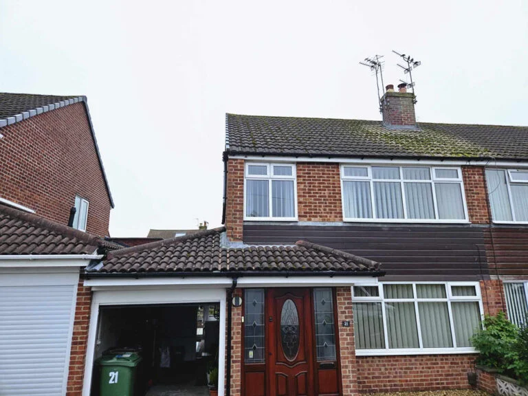 House with a tiled roof and dormer window