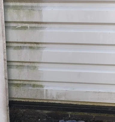Exterior wall cladding before and after a cleaning test