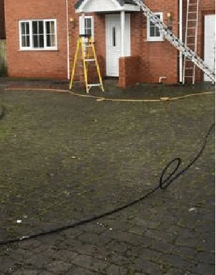 Driveway before pressure washing