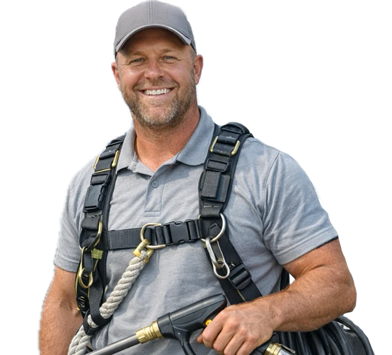 Exterior cleaning professional wearing safety equipment