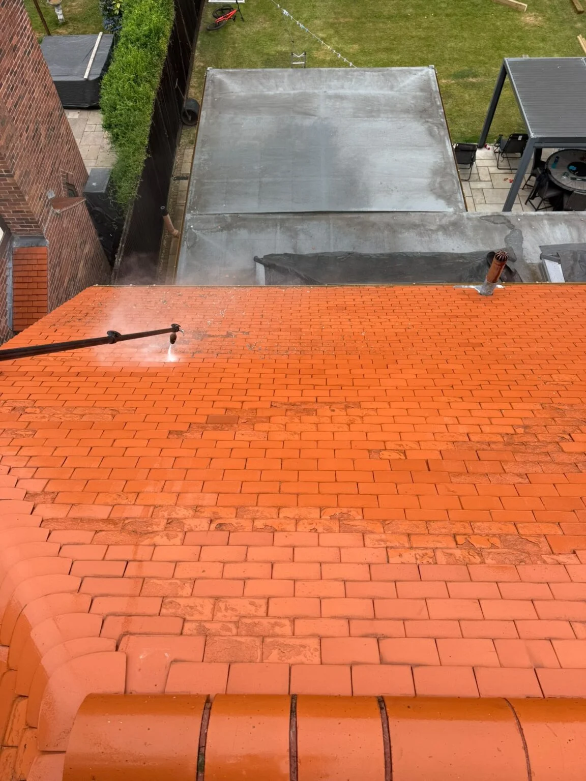Cleaned test area on the red tiled roof in St Helens